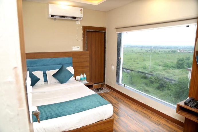 Imagen de la habitación del Hotel JMC Safar Inn Mhow. Foto 11