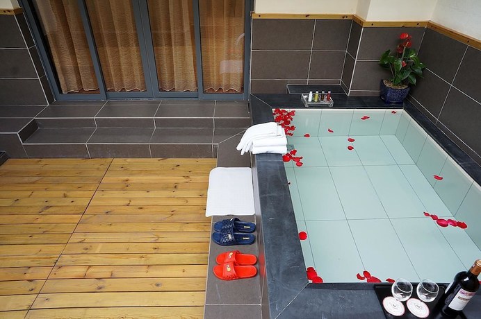 Imagen de la habitación del Hotel Jade Time Villa Hotel Tengchong. Foto 17