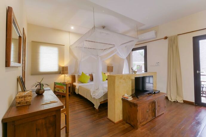 Imagen de la habitación del Hotel Jambiani Villas. Foto 19