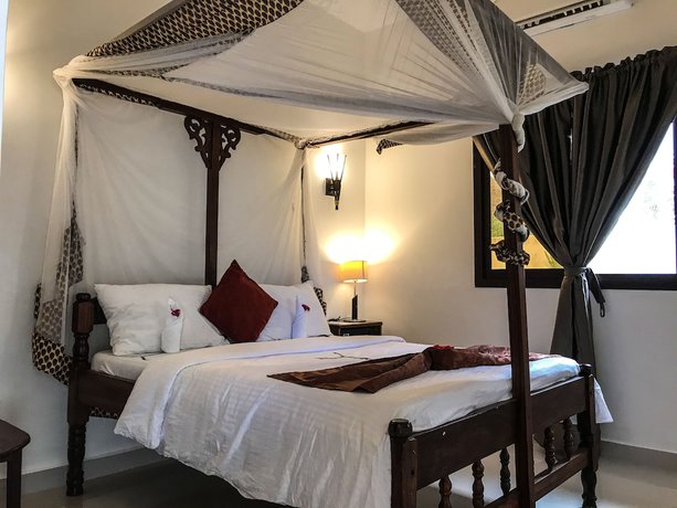 Imagen de la habitación del Hotel Jambiani White Sands Beach Bungalows. Foto 4