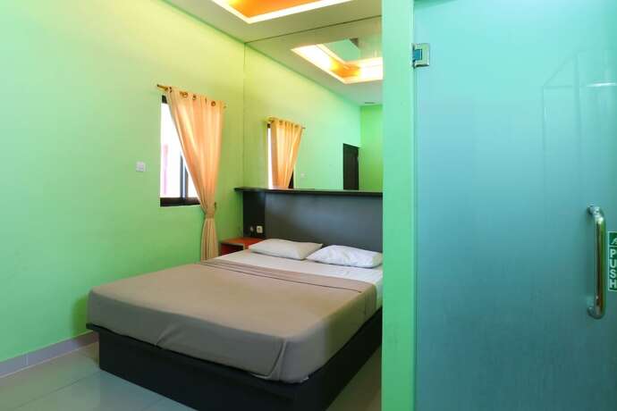 Imagen de la habitación del Hotel Jambrut Inn. Foto 33