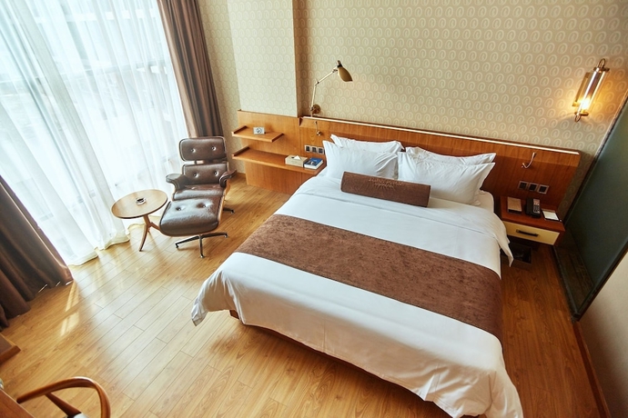 Imagen de la habitación del Hotel James Joyce Coffetel Qifu Xincun Branch. Foto 13