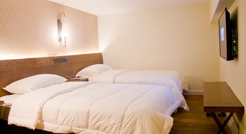 Imagen de la habitación del Hotel James Joyce Coffetel Tianhebei. Foto 2