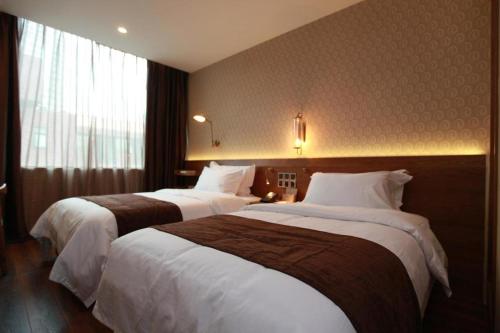 Imagen general del Hotel James Joyce Coffetel Wuxi Taihu Square Subway Station Branch. Foto 15