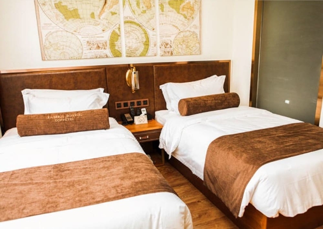 Imagen de la habitación del Hotel James Joyce Coffetel Xi'an Huaqingchi. Foto 4