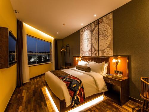 Imagen de la habitación del Hotel James Joyce Coffetel (Xi'an Nanmen Ming City Wall. Foto 5