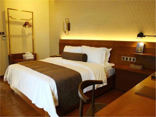 Imagen de la habitación del Hotel James Joyce Qingyuan City Hall. Foto 8