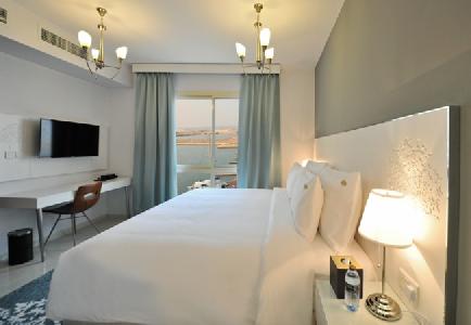 Imagen del bar/restaurante del Hotel Jannah Resort and Villas Ras Al Khaimah. Foto 4