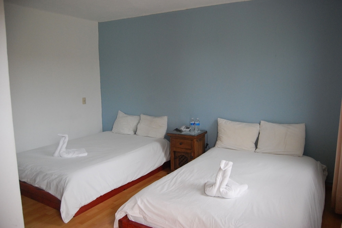 Imagen de la habitación del Hotel Jardines De Luz. Foto 5