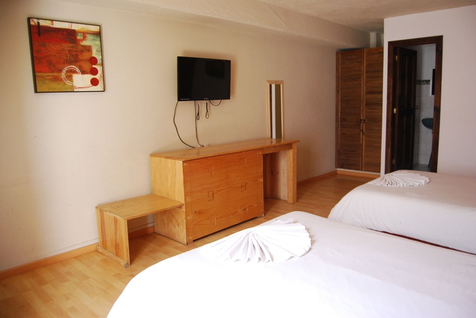 Imagen de la habitación del Hotel Jardines De Luz. Foto 7