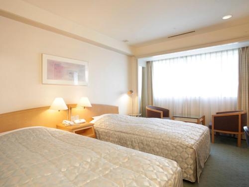 Imagen de la habitación del Hotel Jasmac Plaza. Foto 6