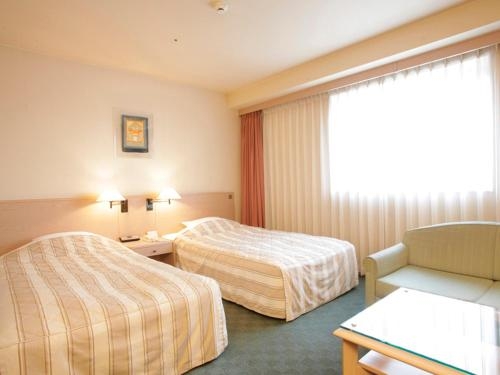 Imagen de la habitación del Hotel Jasmac Plaza. Foto 8