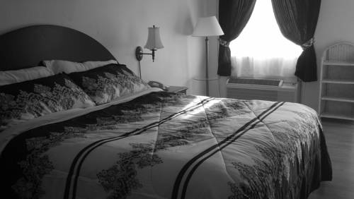 Imagen de la habitación del Hotel Jasmine Garden Inn. Foto 13