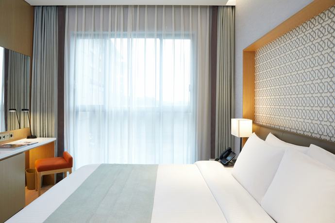 Imagen de la habitación del Hotel Jeju Shinhwa World Landing Resort. Foto 13