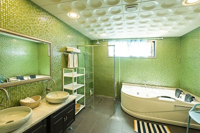 Imagen de la habitación del Hotel Jejueco Suites. Foto 18
