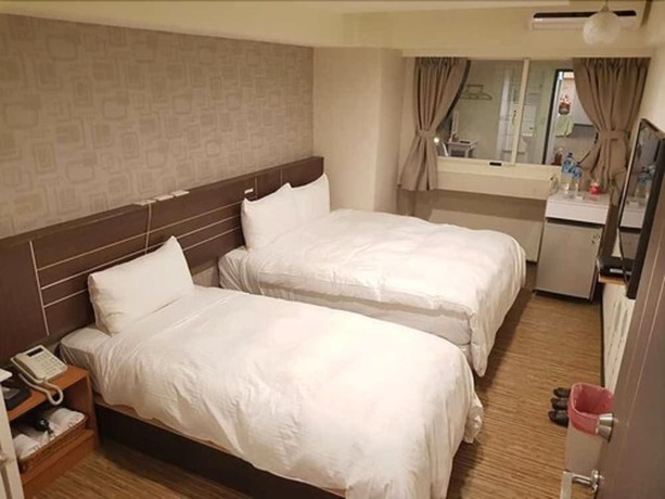 Imagen de la habitación del Hotel Jhong-sing. Foto 13
