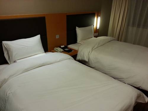 Imagen de la habitación del Hotel Ji Culture Center Tianjin. Foto 5