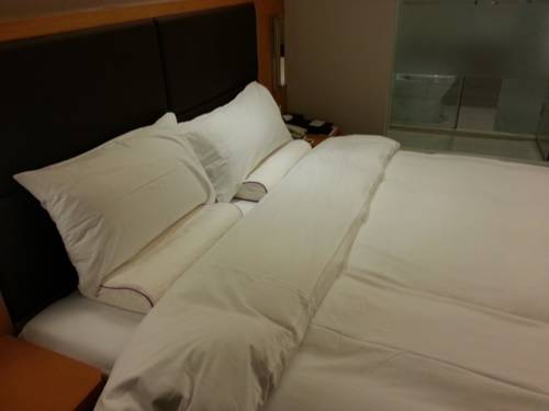 Imagen de la habitación del Hotel Ji Culture Center Tianjin. Foto 6