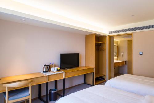 Imagen de la habitación del Hotel Ji Guangzhou Tianhe East Railway Station. Foto 8