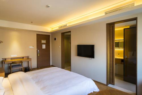 Imagen de la habitación del Hotel Ji Hotel Changzhou China Dinosaurs Park. Foto 7