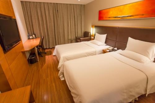 Imagen de la habitación del Hotel Ji Hotel (Shenzhen Convention and Exhibition Center). Foto 6