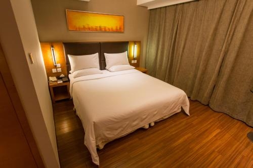 Imagen de la habitación del Hotel Ji Hotel (Shenzhen Convention and Exhibition Center). Foto 7