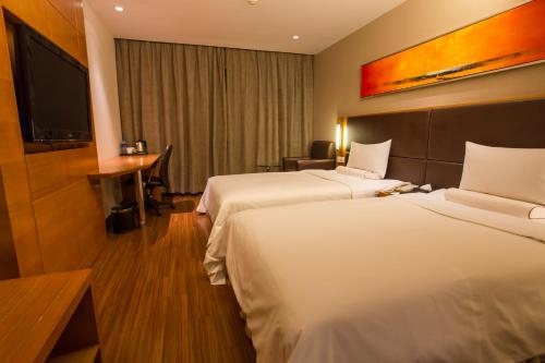 Imagen de la habitación del Hotel Ji Hotel (Shenzhen Convention and Exhibition Center). Foto 9