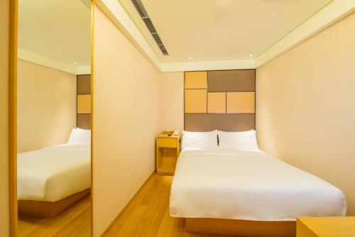 Imagen de la habitación del Hotel Ji Jinan Jingshi Road Harmony Square. Foto 8