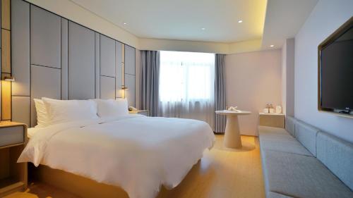 Imagen de la habitación del Hotel Ji Shanghai Hongqiao National Convention And. Foto 7