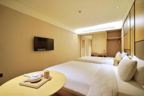 Imagen de la habitación del Hotel Ji Shanghai Hongqiao Transport Hub Linkong Z. Foto 8