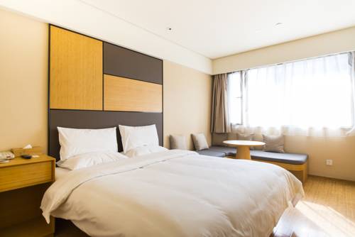 Imagen de la habitación del Hotel Ji Shanghai Stadium. Foto 2
