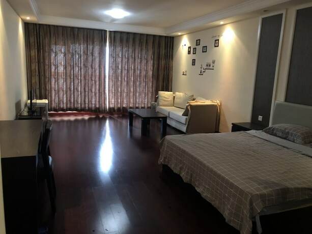 Imagen de la habitación del Hotel Jia Zhao Ye Sunny Seaview Apartment. Foto 19