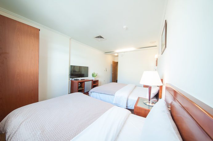 Imagen de la habitación del Hotel JiaHua. Foto 17