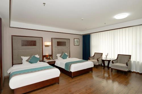 Imagen de la habitación del Hotel Jiahua - Wanzai Ancient City. Foto 15