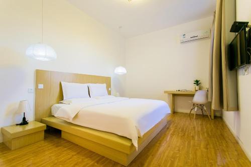 Imagen de la habitación del Hotel Jiajia_home+. Foto 5