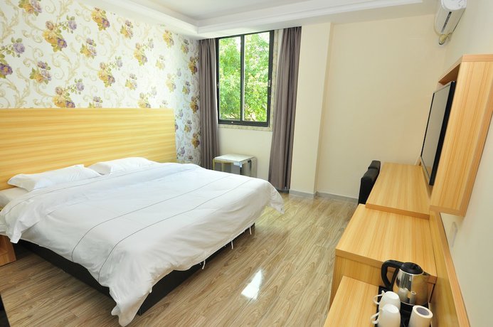 Imagen de la habitación del Hotel Jiamei. Foto 8