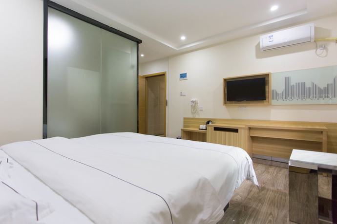 Imagen de la habitación del Hotel Jiamei. Foto 12