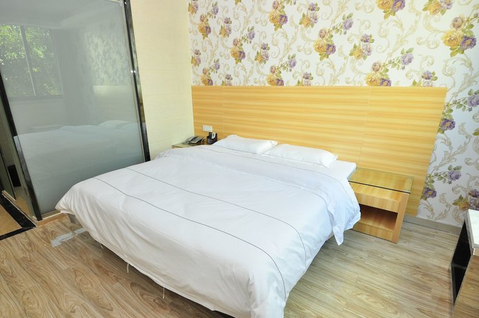 Imagen de la habitación del Hotel Jiamei. Foto 14