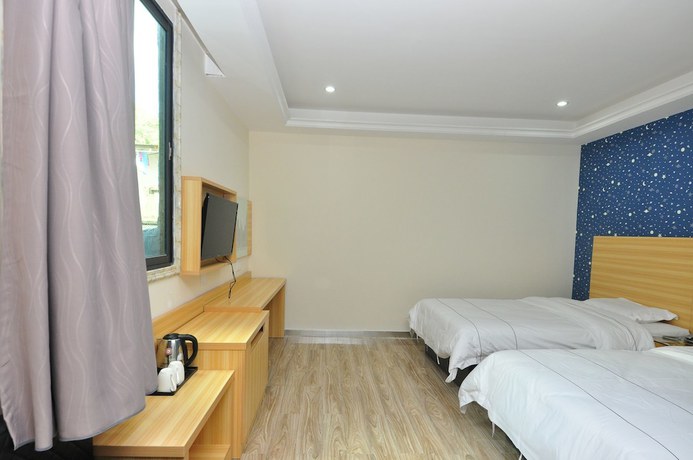 Imagen de la habitación del Hotel Jiamei. Foto 15