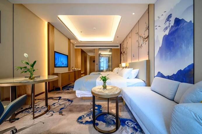 Imagen de la habitación del Hotel Jiangheyujing. Foto 15