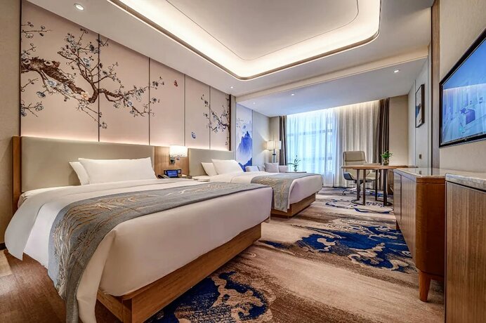 Imagen de la habitación del Hotel Jiangheyujing. Foto 17