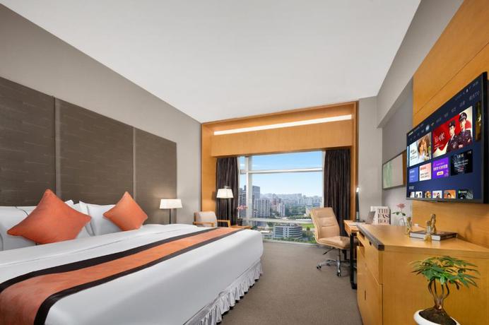 Imagen de la habitación del Hotel Jianguo Guangzhou. Foto 17