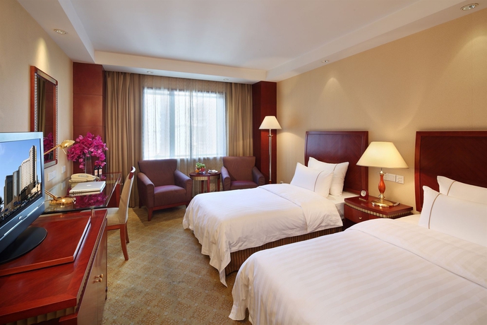 Imagen de la habitación del Hotel Jianguo Shanghai. Foto 10