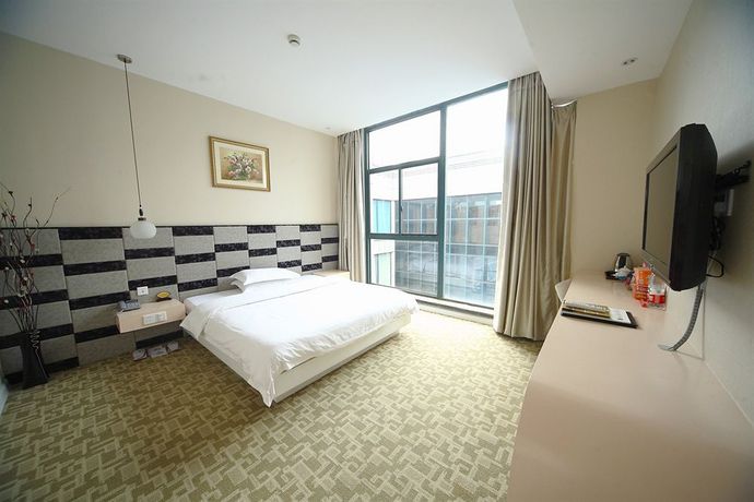 Imagen de la habitación del Hotel Jiaxing Meiwan Modern City. Foto 11