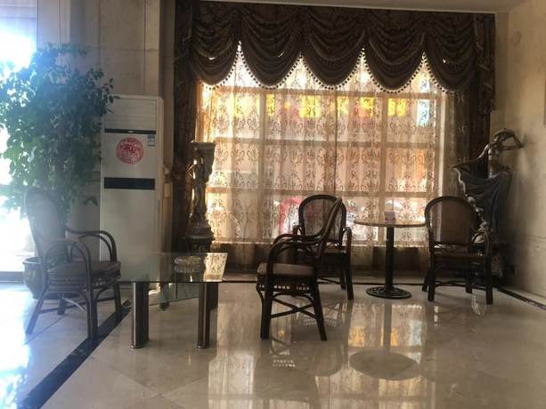 Imagen de los interiores del Hotel Jiaxing Yijiangnan Holiday. Foto 18