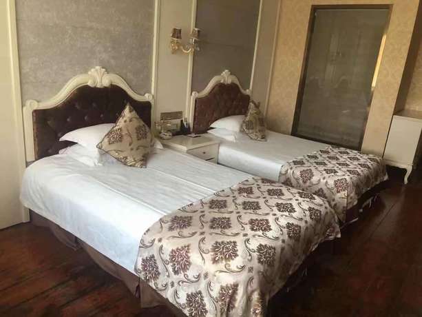 Imagen de la habitación del Hotel Jiaxing Yijiangnan Holiday. Foto 12