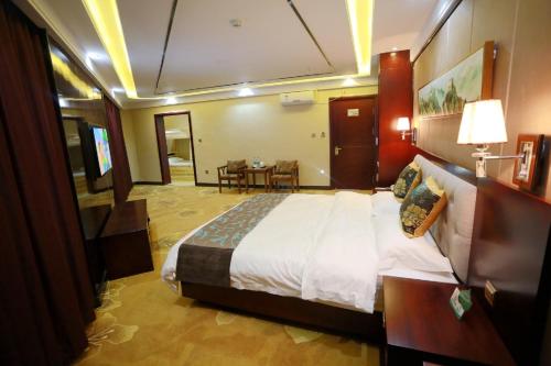 Imagen de la habitación del Hotel Jiayuguan Jingdu Holiday. Foto 5