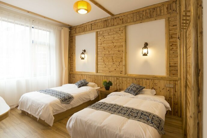 Imagen de la habitación del Hotel Jiesu Renwen Guest House. Foto 17