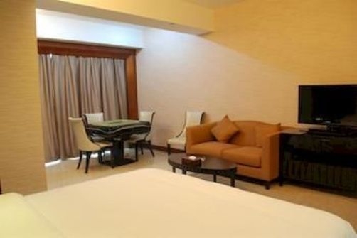 Imagen de la habitación del Hotel Jihua Business. Foto 3