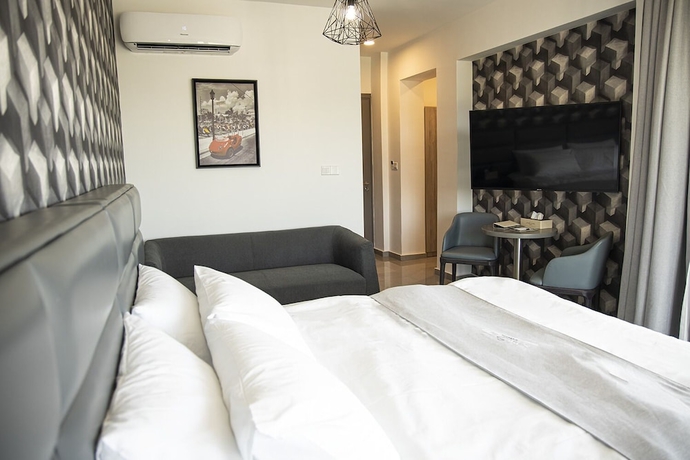Imagen de la habitación del Hotel Jimmy\'s Suites. Foto 2